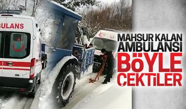 Yolda kalan ambulansı böyle çektiler