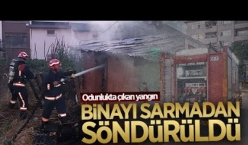 Odunlukta başlayan yangın, binayı sarmadan söndürüldü